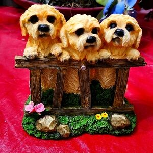 Charming Trio of Dogs on Fence Figurine